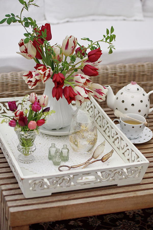 Vase Of Tulips, Wild Roses And Lily-of-the-valley On White Wooden Tray Photograph by Angelica Linnhoff