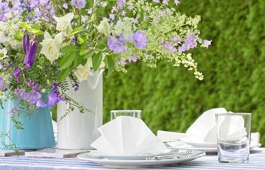 Vases Of Purple And White Flowers On Festively Set Garden Table Photograph by Angela Francisca Endress