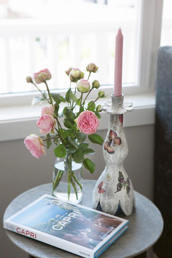 Vases Of Roses, Book About Capri And Candlestick On Side Table Photograph by Annette Nordstrom