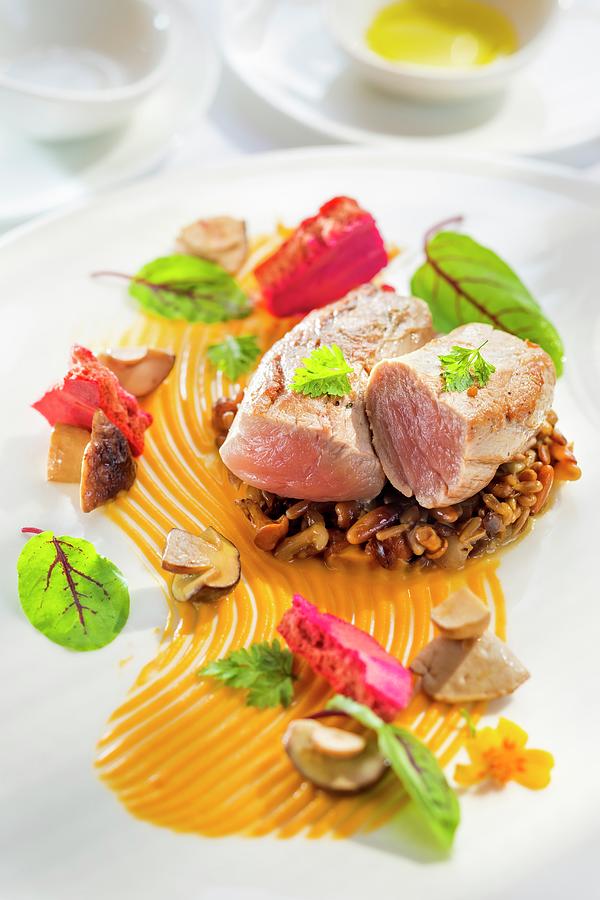 Veal Fillet On A Bed Of Risotto With Sunflower Seeds, Pumpkin Seeds And Hazelnuts On A Pumpkin Pure Photograph by Lukasz Zandecki