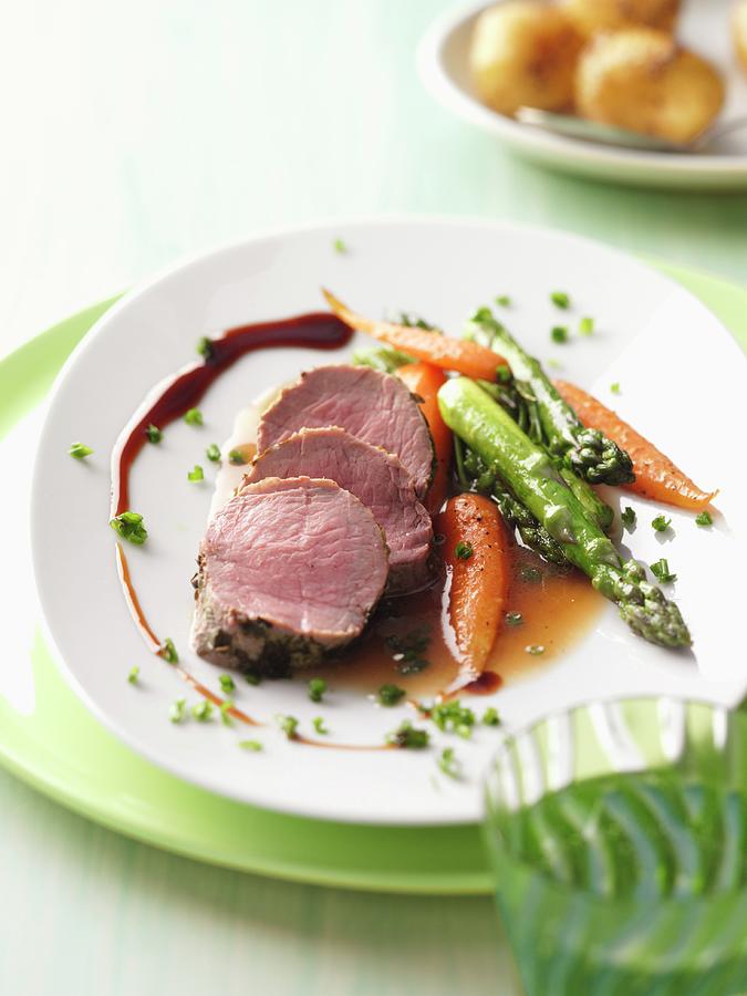 Veal Fillet With A Herb Crust, Green Asparagus And Carrots Photograph by Kramp + Glling Jalag