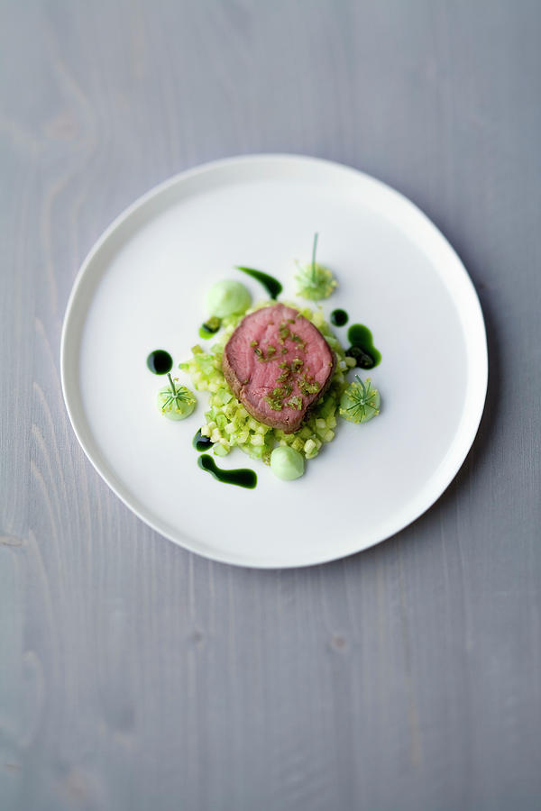 Veal Fillet With An Anise Glaze And Avocado And Pineapple Salsa Photograph by Michael Wissing