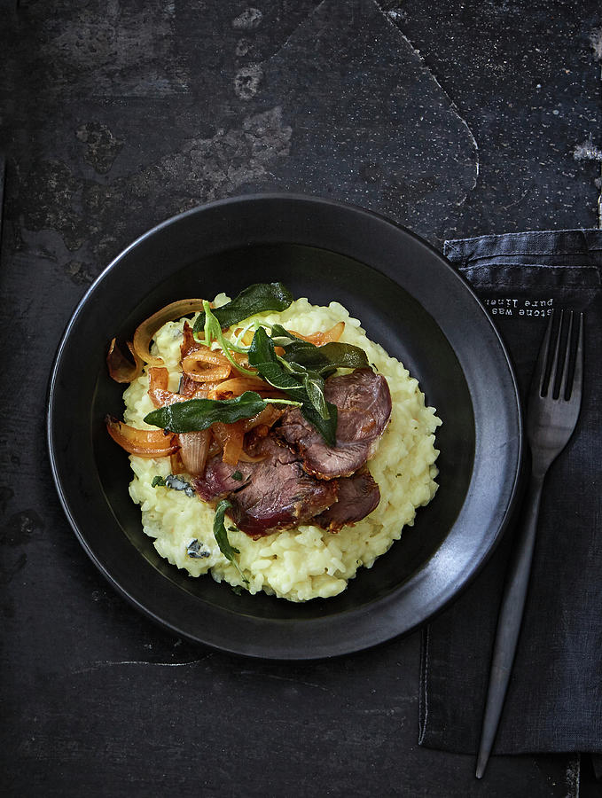 Veal Knuckle In A Salted Coating On Risotto Photograph by