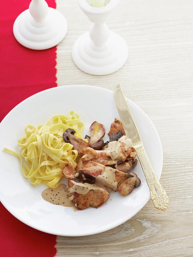 Veal Schnitzel With Mushroom Sauce And Ribbon Pasta Photograph by Atelier Mai 98