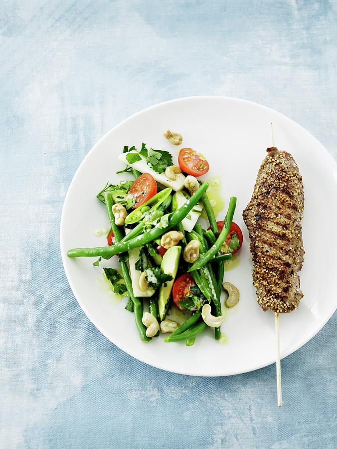 Veal Skewer With Sesame Seeds And A Bean Salad Photograph by Mikkel Adsbl