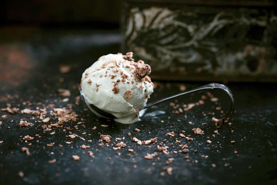 Vegan Avocado Ice Cream With Muesli Topping On A Spoon Photograph by Kati Neudert
