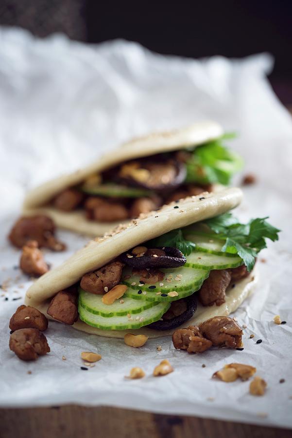Vegan Bao Tacos With Soya Strips, Cucumber, Shiitake Mushrooms, Roasted Peanuts And Sesame Seeds Photograph by Kati Neudert