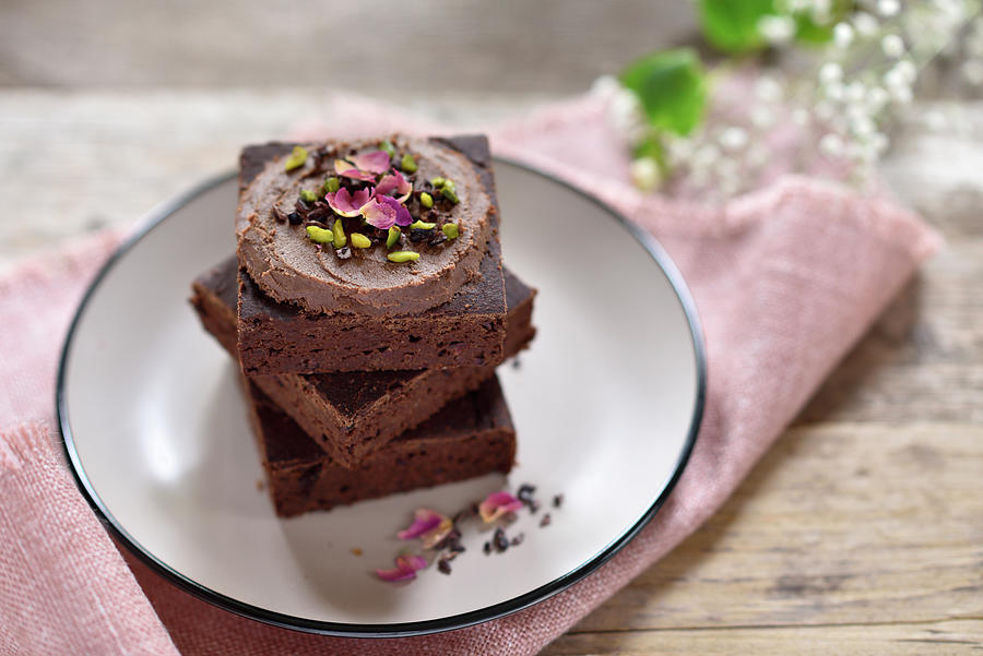 Vegan Black Bean Date Brownies With Hazelnut Chocolate Cream, Cocoa Nibs, Pistachios And Rose Petals Photograph by B.b.s Bakery