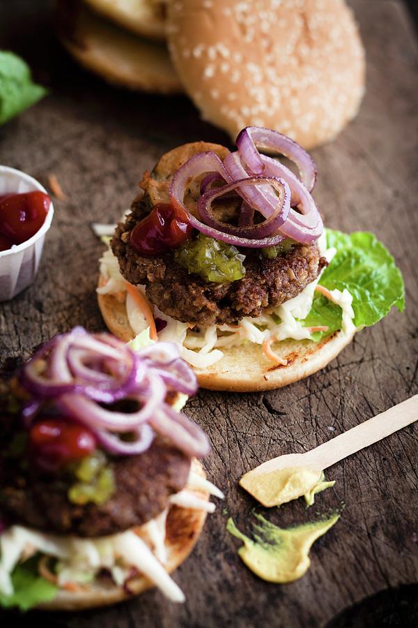 Vegan Burger With Cucumber Relish, Ketchup, Mustard And Red Onions Photograph by Eising Studio