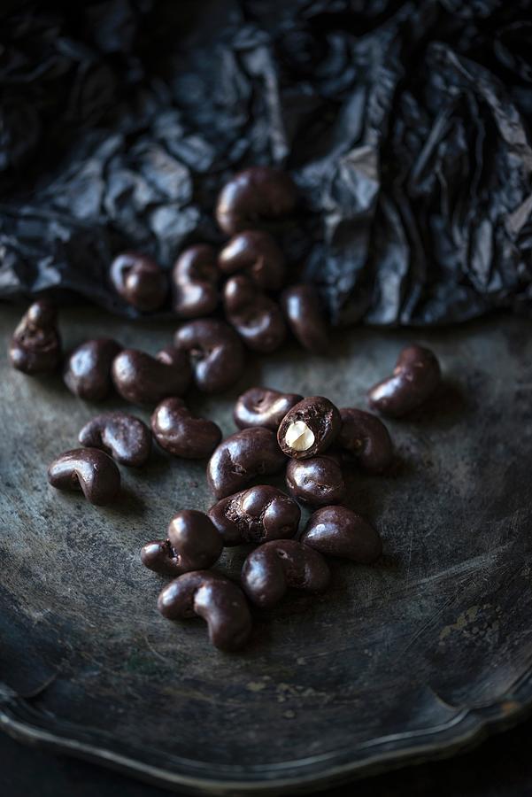 Vegan Cashew Nuts Coated In Dark Chocolate Photograph by Kati Neudert