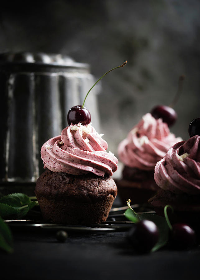 Vegan Chocolate Cupcakes Topped With Cherry Butter Cream Frosting Photograph by Kati Neudert