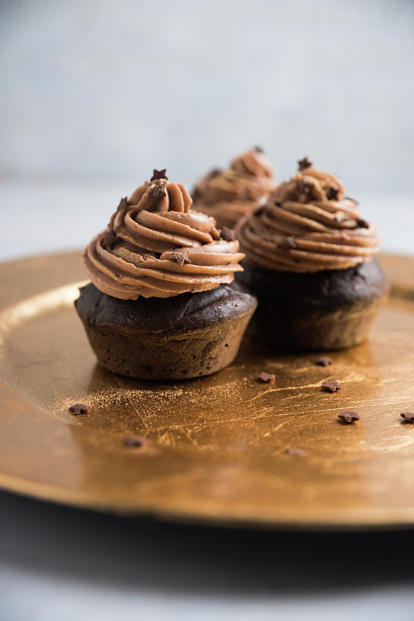 Vegan Chocolate Muffins With Nougat Cream, Chocolate Stars And Gold Powder Photograph by Kati Neudert