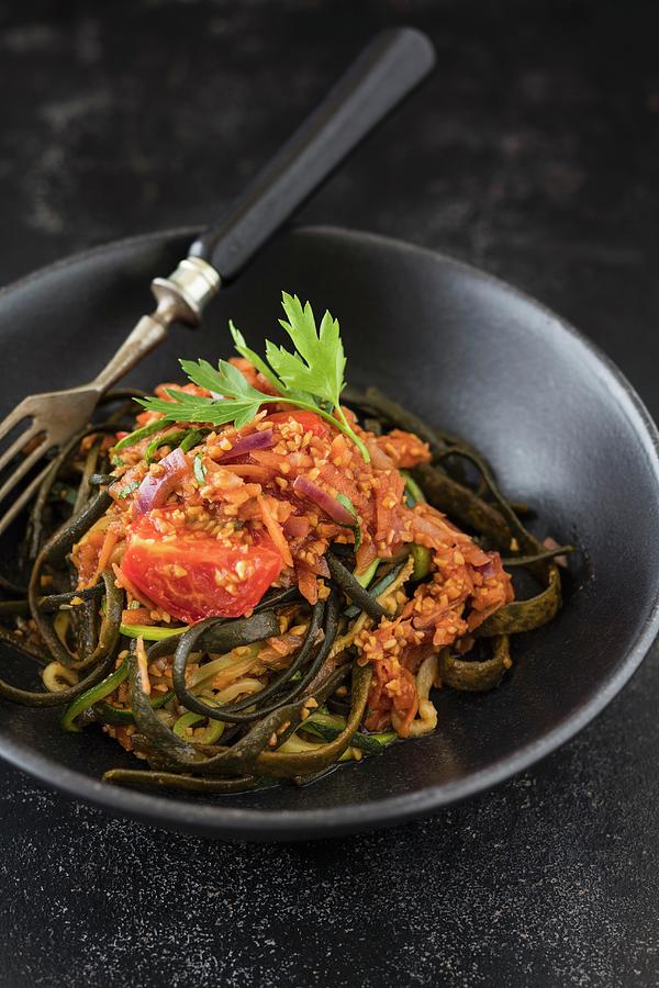 Vegan Courgette And Seaweed Pasta With Bolognese Sauce Made From Cracked Lupine Photograph by Jan Wischnewski