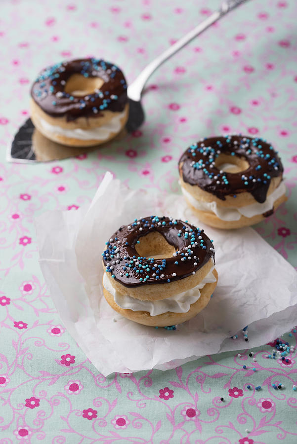 Vegan Dark-glazed Donuts Filled With Vanilla Soy Cream Photograph by Kati Neudert