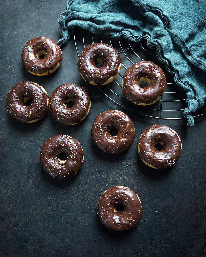Vegan Doughnuts With A Cocoa And Coconut Glaze And Colourful Sugar Sprinkles Photograph by Kati Neudert