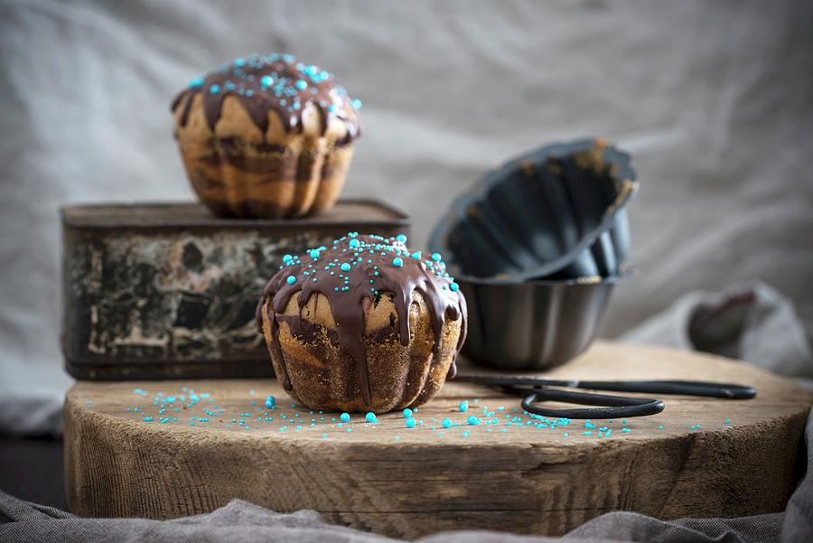 Vegan Giant Muffins With A Nougat Chocolate Glaze And Sugar Pearls Photograph by Kati Neudert