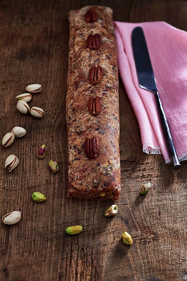 Vegan, Gluten-free Date Strudel With Pistachios And Pecan Nuts Photograph by Helena Krol