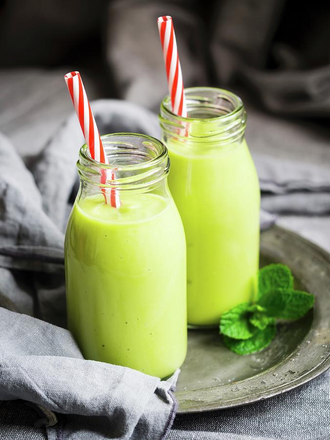 Vegan Green Smoothies In Glass Bottles With Straws Photograph by Magdalena Paluchowska