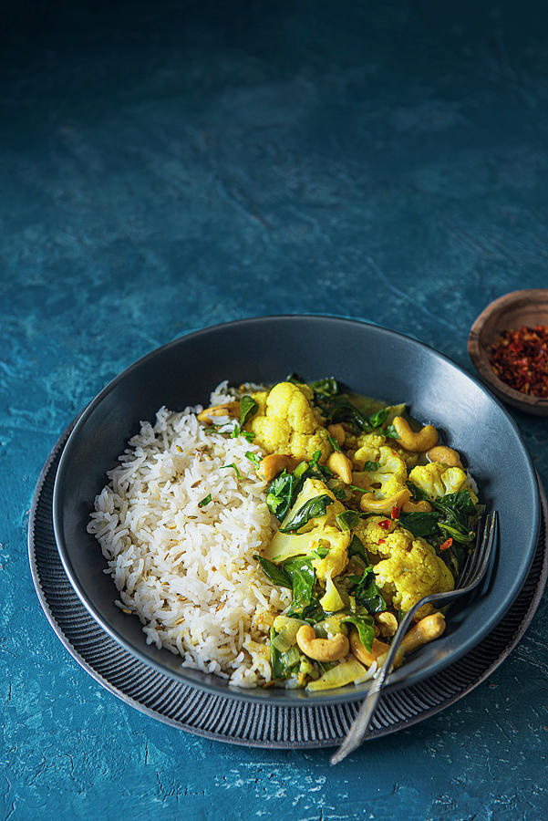 Vegan Indian Cauliflower And Cashewnut Curry With Spinach And Rice Photograph by Magdalena Hendey Gough