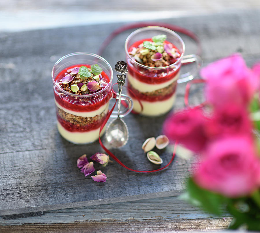 Vegan Layered Dessert In Jars With Granola, Vanilla Yoghurt Cream And Raspberries Photograph by B.b.s Bakery