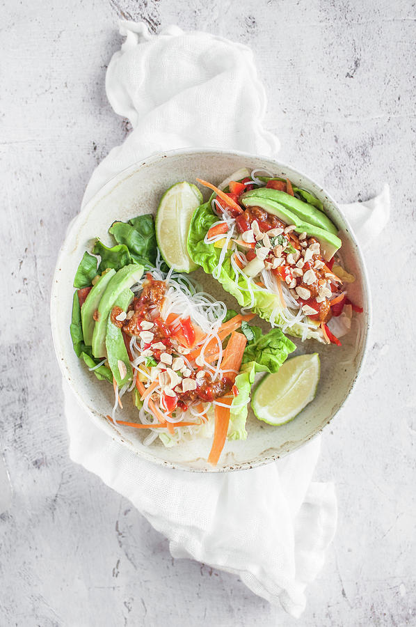 Vegan Lettuce Wraps Stuffed With Rice Noodles Vermicelli, Bell Pepper, Carrot, Avocado, Sriracha And Pinenuts Photograph by Kachel Katarzyna
