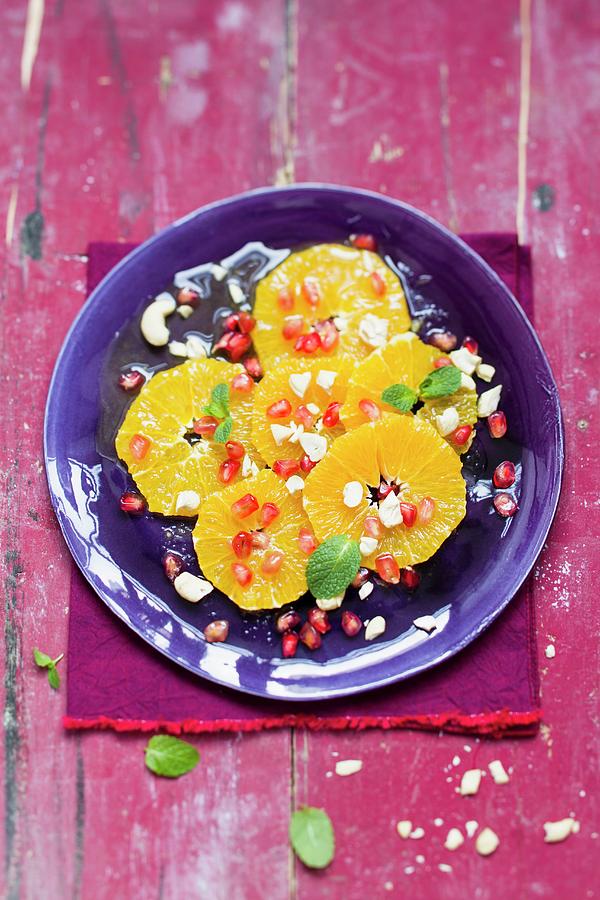 Vegan Orange Salad With Pomegranate Seeds And Cashew Nuts Photograph by Sporrer/skowronek
