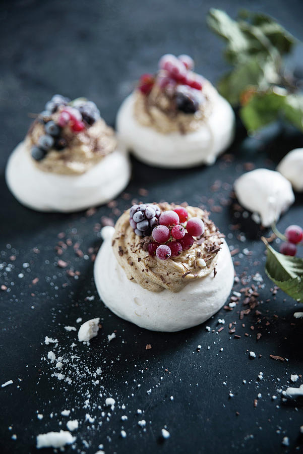 Vegan Pavlova Made With Aquafaba, Topped With Coffee Butter Cream And Frozen Berries Photograph by Kati Neudert