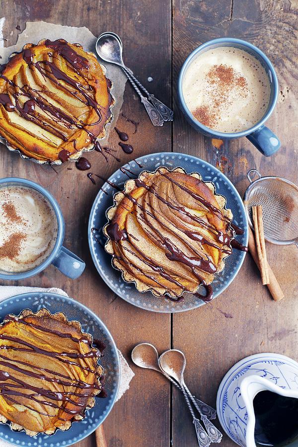 Vegan Pear And Pumpkin Tartlets Drizzled With Chocolate Photograph by Natalia Mantur