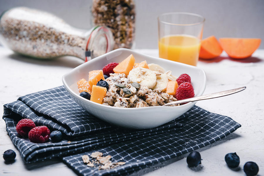 Vegan Porridge With Fresh Fruits And Orange Juice Photograph by Kati Neudert