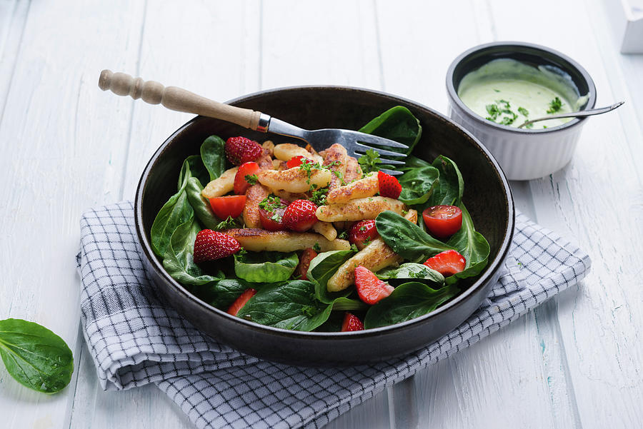 Vegan Schupfnudeln With Spinach And Strawberry Salad And Herb Dressing Photograph by Kati Neudert