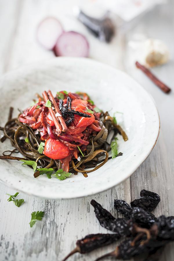 Vegan Seaweed Tagliatelle With Tomatoes, Onions, Garlic, Cinnamon And Smoked Chipotle Chilli Photograph by Jan Wischnewski