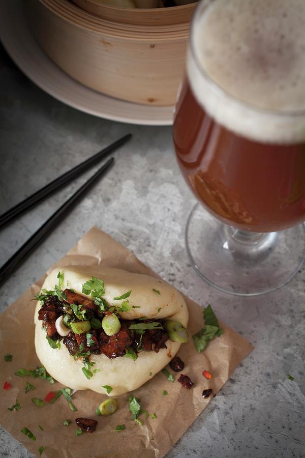 Vegan Steamed Bao Bun Filled With Smoked Tofu And Chestnut Mushrooms Marinated In Soy, Sesame Oil, Chilli Sauce And Garlic, Topped With Sliced Spring Onions, Corriander And Red Chilli Photograph by Victoria Harley