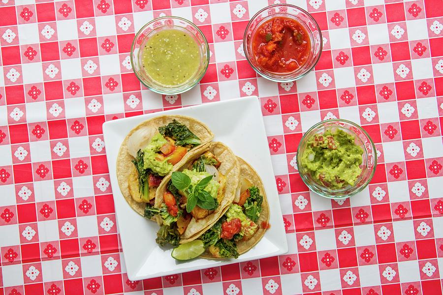 Vegan Tacos With Kale, Guacamole, Salsa, And Salsa Verde On A Red-and-white Checked Tablecloth Photograph by Kelly Peloza Photo