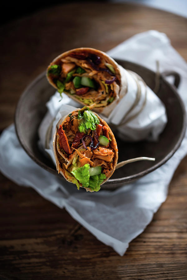 Vegan Tortilla Wraps Filled With Pulled Jackfruit, Dried Tomatoes, Red Onions, Cucumber And Lettuce Photograph by Kati Neudert