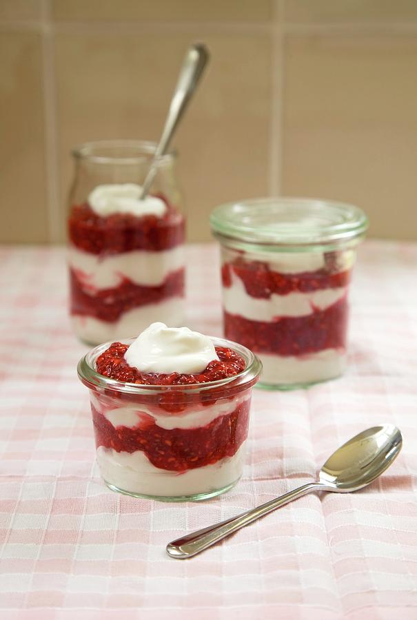 Vegan Yoghurt Dessert With Raspberries Layered In Glasses Photograph by Joy Skipper Foodstyling