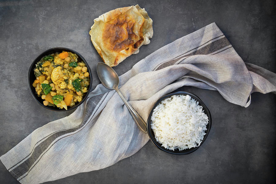 Vegetable Curry With Cauliflower, Butternut Squash, Spinach And Coriander Served With Poppadoms And Rice Photograph by Larissa Veronesi