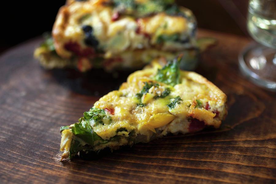 Vegetable Fritatta On A Wooden Board close-up Photograph by Katharine Pollak