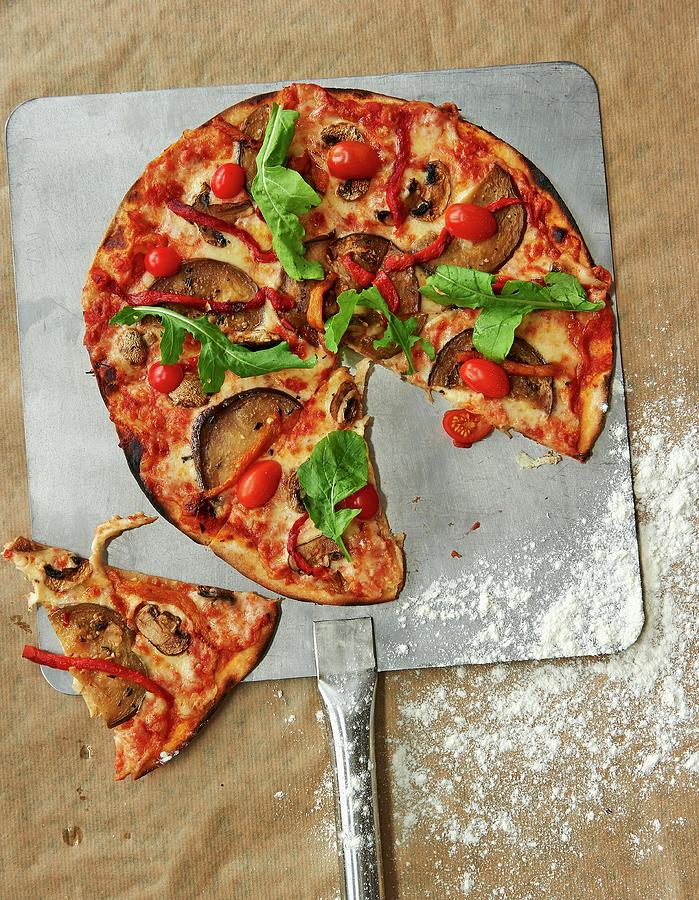Vegetable Pizza With Tomatoes, Aubergines And Rocket, Sliced Photograph by Robbert Koene