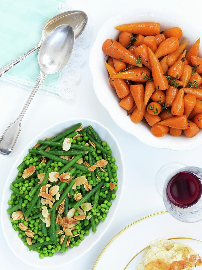 Vegetable Side Dishes For Easter: Peas And Beans With Flaked Almonds, And Glazed Baby Carrots Photograph by Jonathan Gregson