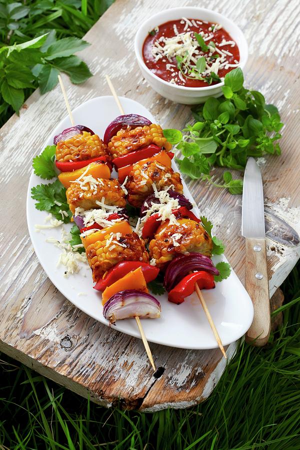 Vegetable Skewers Topped With Grated Cheese Photograph by Boguslaw Bialy