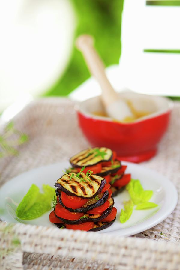 Vegetable Stacks Of Grilled Aubergine Slices And Tomatoes Photograph by Studio Lipov