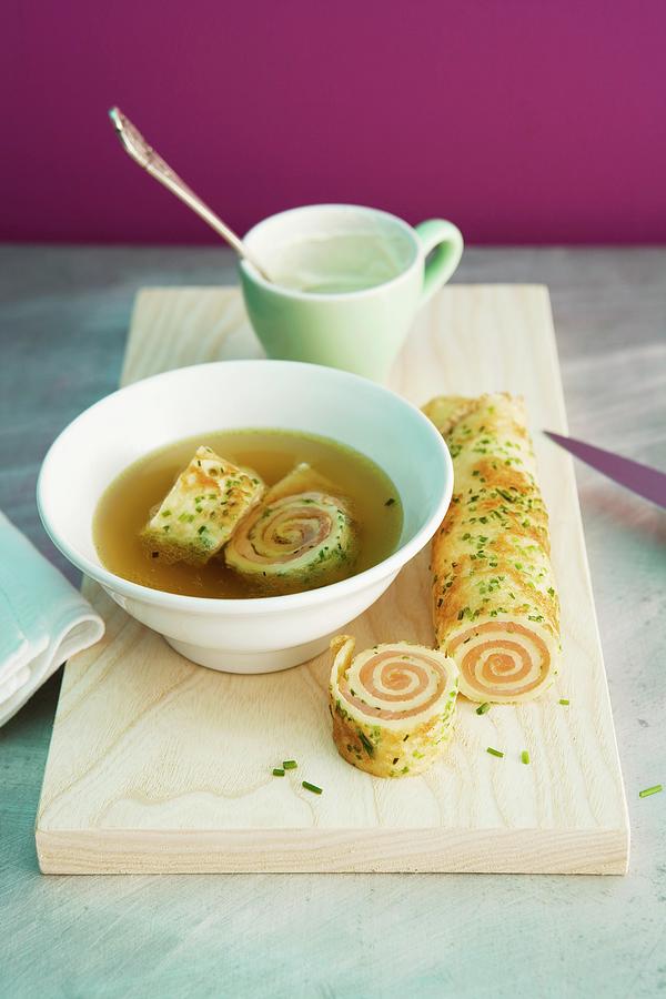 Vegetable Stock With Salmon Pancake Rolls Photograph by Michael Wissing
