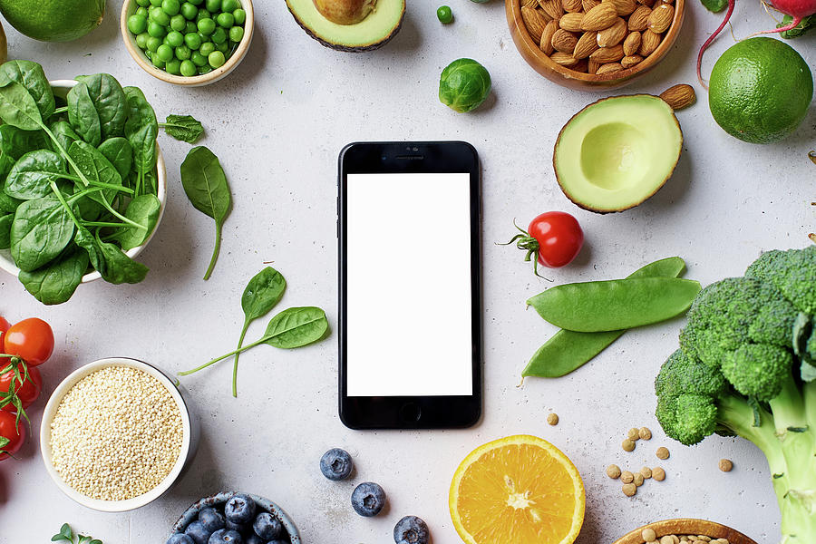 Vegetables, Fruit, Lentils And Almonds Arranged Around A Smartphone Photograph by Asya Nurullina