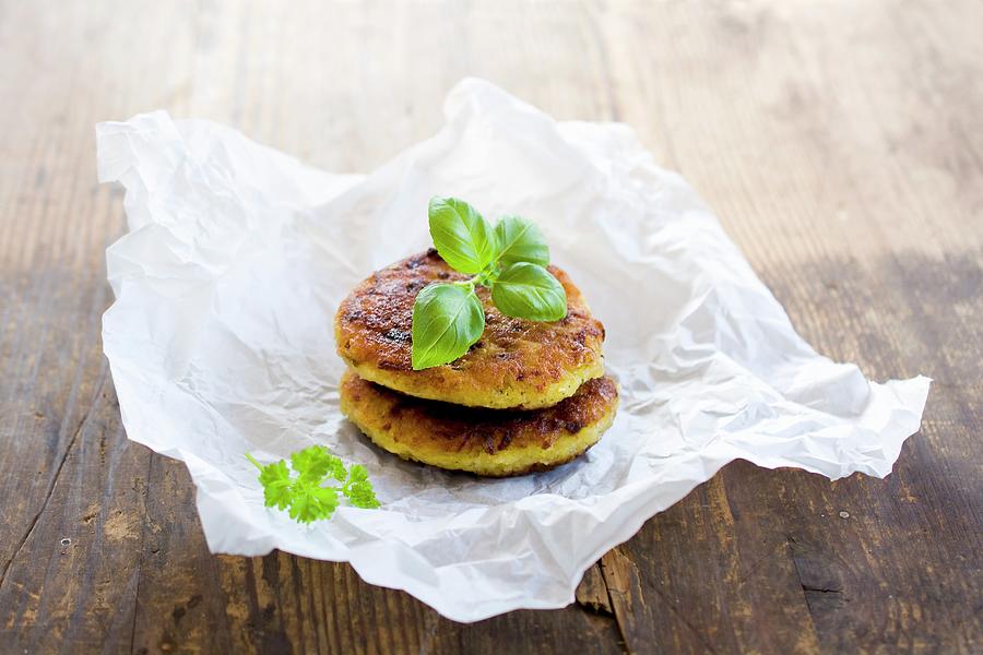 Vegetarian Millet Burgers With Kohlrabi And Herbs On A Piece Of Paper Photograph by Mariola Streim