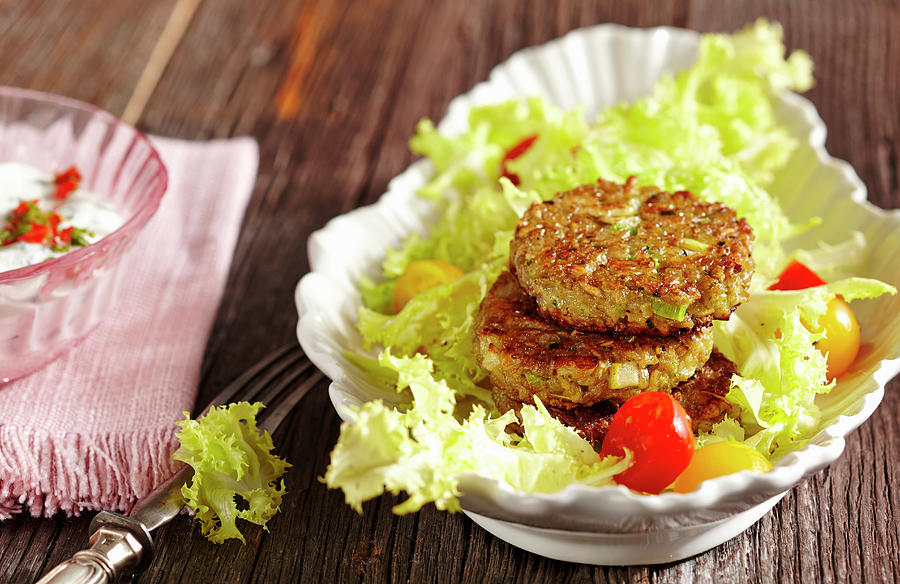 Vegetarian Spelt Patties On Frisee Salad Photograph by Teubner Foodfoto