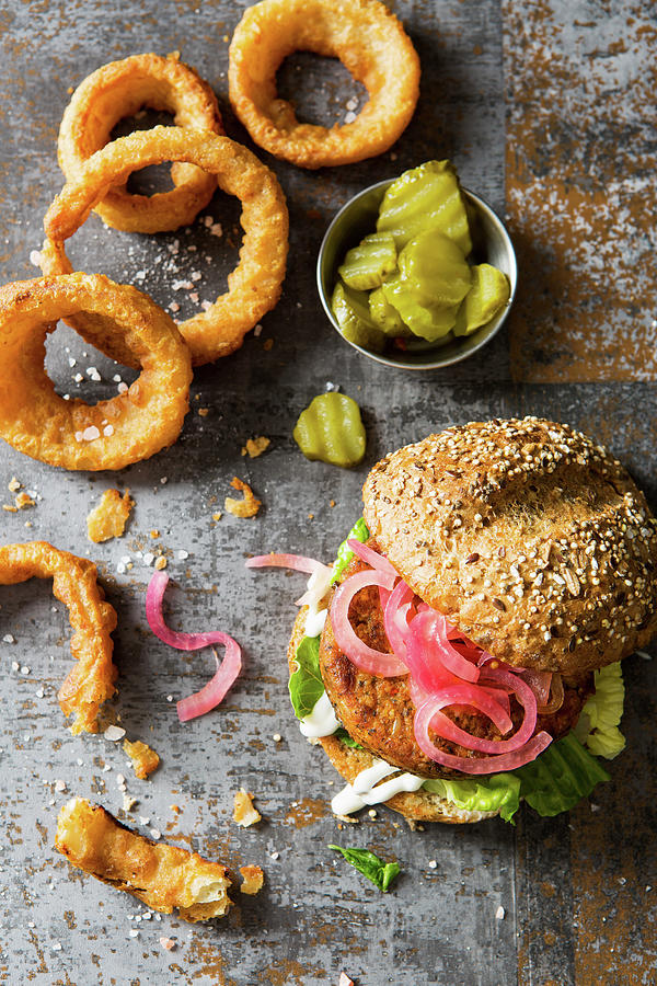Veggie Vegan Burger Made With Cauliflower Beans And Pickled Red Onions And Fried Onion Rings Photograph by Stacy Grant