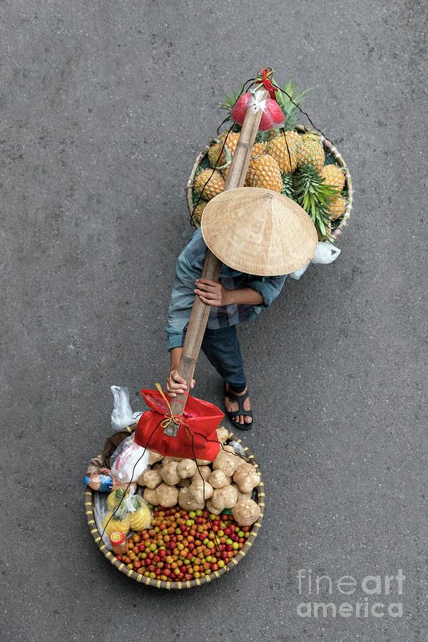 Vendor Using A Carrying Pole In Hanoi Photograph by Tony Camacho/science Photo Library