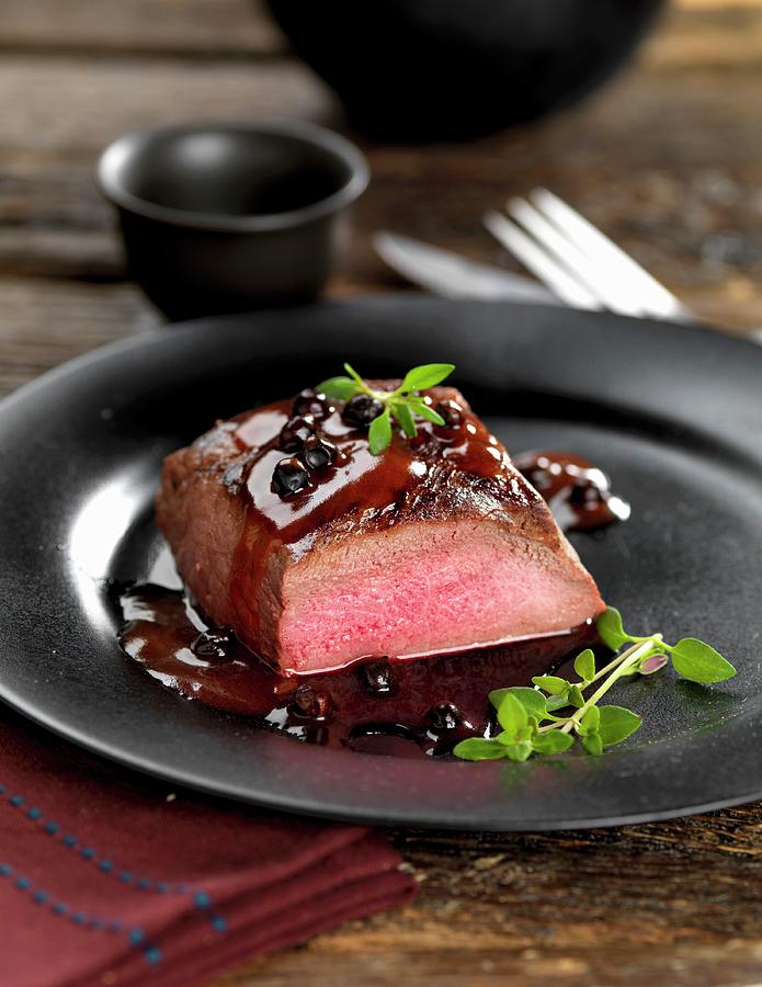 Venison Steak With A Juniper Berry Sauce Photograph by Robert Morris