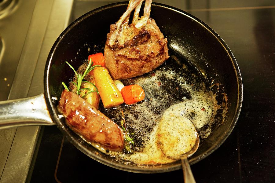 Venison With Vegetables And Herbs Being Fried In A Pan Photograph by Rita Newman