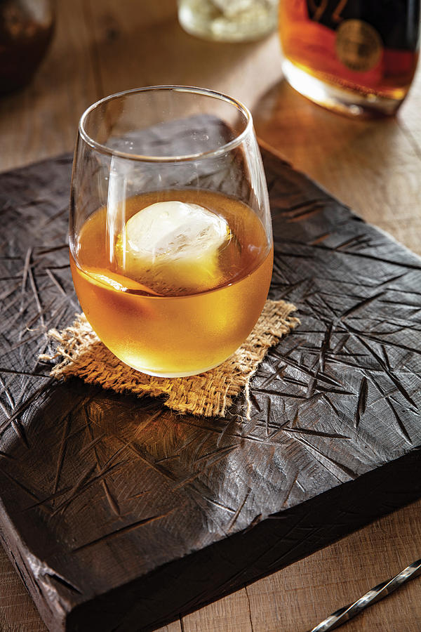 Vermouth And Bourbon Coacktail With Ice Cube Photograph by Cindy Haigwood